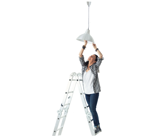 Woman adjusting a lighting fixture on a ladder